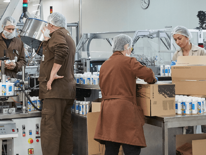 photo of a diverse team working in a manufacturing plant