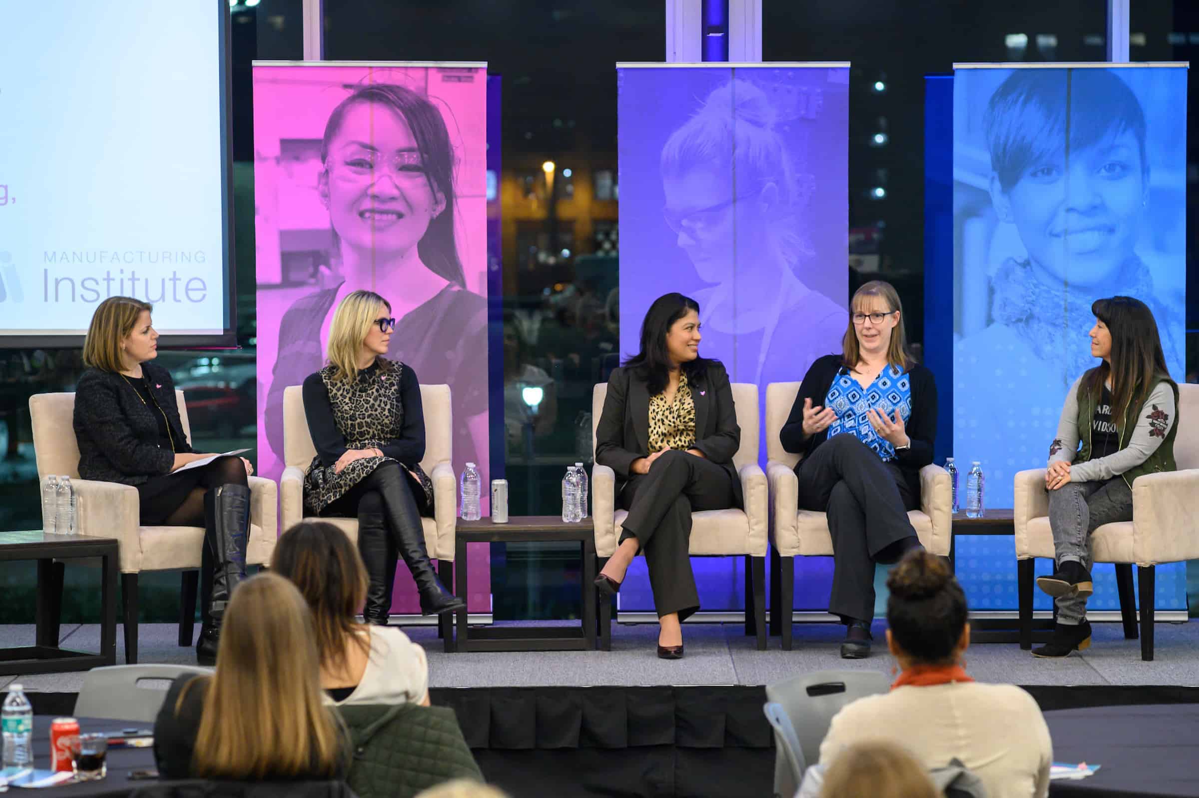 Panel discussion at The Manufacturing Institute event with diverse speakers.